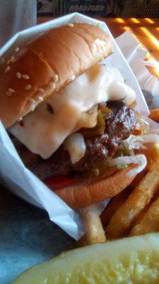 Farley's huge Mesilla Mex Burger. Grilled onions were greasy and bun deteriorated. Must use a knife and fork. Under seasoned meat.