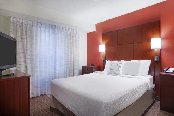 The one-bedroom suite has a separate bedroom with a plush queen-sized and flat-screen TV.