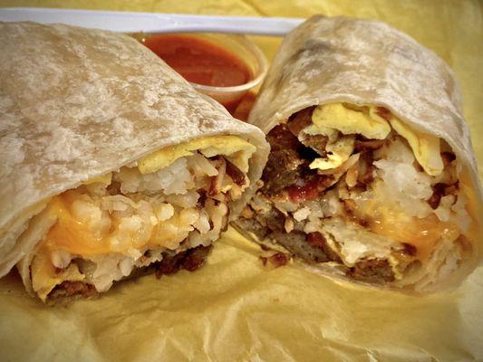 Sausage, bacon & eggs breakfast burrito w/ hashbrowns & cheese. Salsa on side, great.