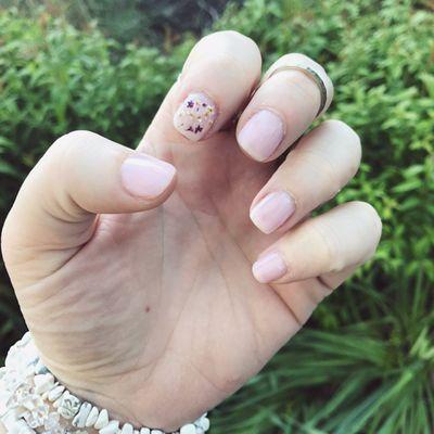 Gel manicure with flower pressed accent nail