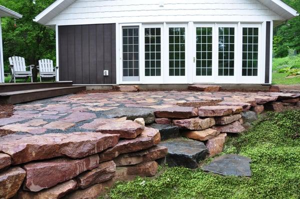 Natural courtyard Patio and Retaining Wall located in Holcombe, WI