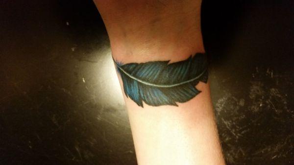 Wrist feather done by Artist Wes