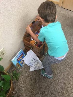 Treasure Box!!! Wow! Dario was thrilled to pick out a prize from the treasure box after his cleaning! He's a Happy camper!