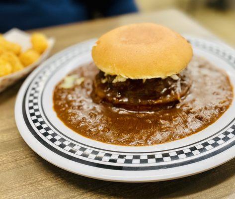 the floating burger comes with your choice of cheese, slaw, fries or tots...