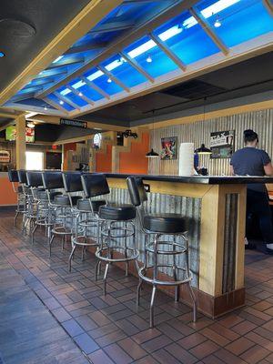 Counter and stools, might get dizzy and fall off if you eat too fast- but it's a option