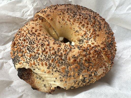 Everything Bagel toasted dark, with Cream Cheese, please.