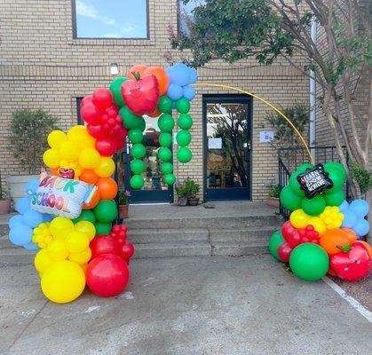 Organic balloon arch to welcome back some very special students.