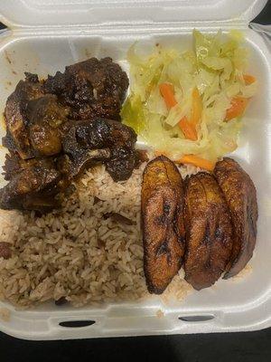 Cabbage, oxtail, plantains, rice and beans