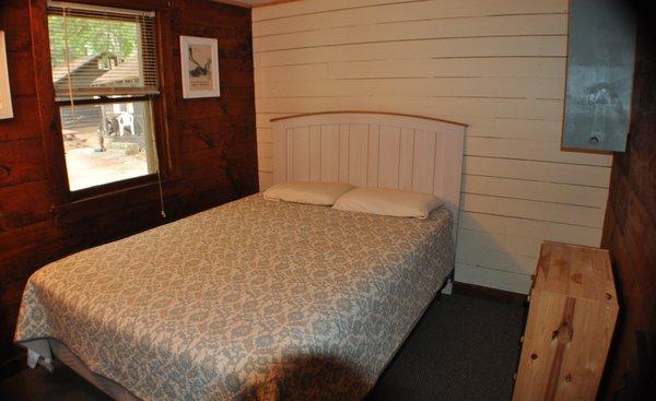 Cottage 8, 9, 10 - knotty pine bedroom with queen bed