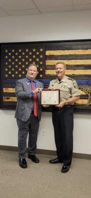 Receiving an award from Loudoun Sheriff James Chapman for donation of a K9Vest for the department