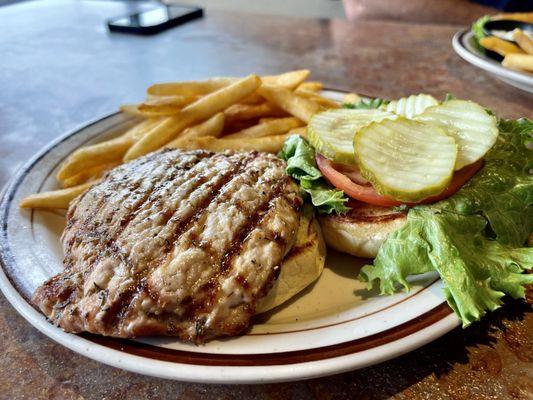 Tenderloin sandwich with beet battered fries.