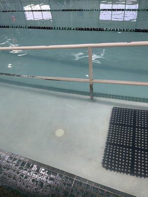 Water in the children's pool, almost too murky to see the lines in the pool