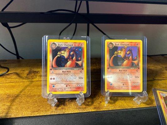 1st Edition Zard. Holo left. Non Holo right.