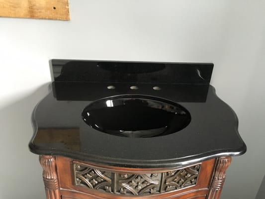 Black Galaxy Granite Vanity with Premium Ogee edge.