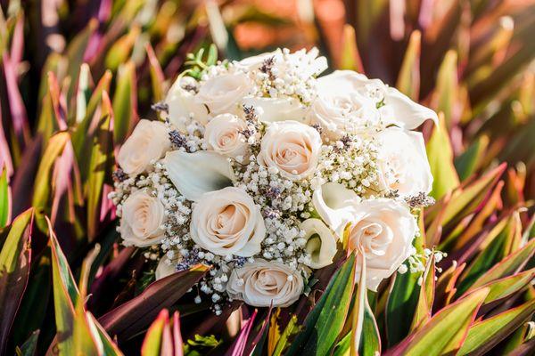 Bridal Bouquet featuring creme roses, white mini callas, baby's breath and a touch of dried lavender.