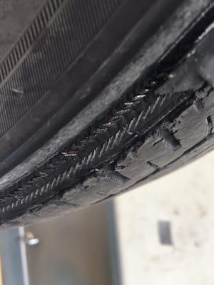 Complete road hazard, damaged tire.