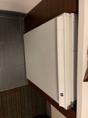 Broken refrigerator in kitchen