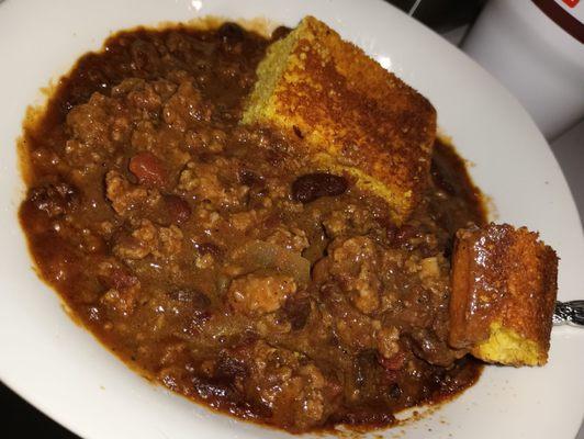 Homemade from scratch slow-simmered well-seasoned chili Daily LUNCH SPECIAL of the Day with corn bread