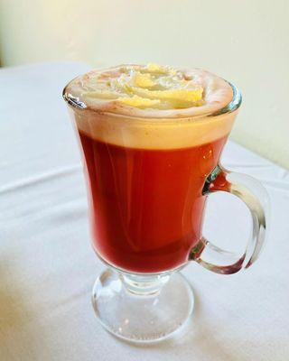 Cherry blossom tea with milk, sugar, cardamom, and whipped cream! Better than a cocktail!