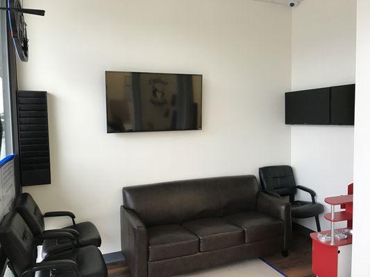 comfortable waiting room with beverage services and play kitchen and xbox for kids