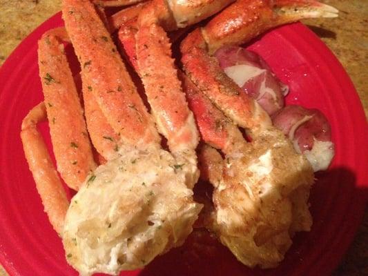 Two clusters of broiled snow crab legs