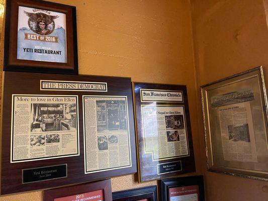 Articles posted about the restaurant on the wall at Yeti Restaurant in Glen Ellen.