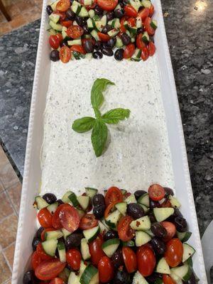 Tzatziki dip with simple Greek salad to eat with pita chips