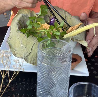 Fresh veggies, served in a banana leaf with a curry sauce