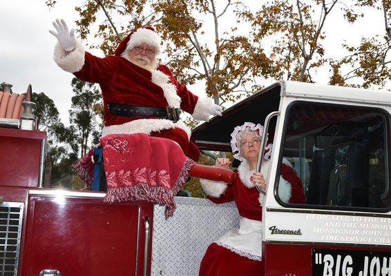 Santa and Mrs Claus always arrive atop "Big John" firetruck from Mission Viejo.