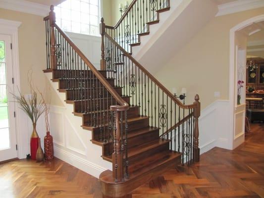 Atherton Stair. Walnut posts and railings with copper iron balusters