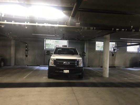 Truck double-parked in private tenant spaces.