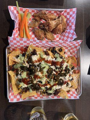 Loaded brisket nachos and lemon pepper wings.