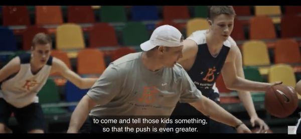 Larry Sanders of Evolve working NBA All-Star Kristaps Porzingis summer camp with Latvian youth national team players.