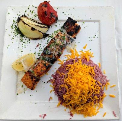 Skewer of salmon with tart cherry rice.