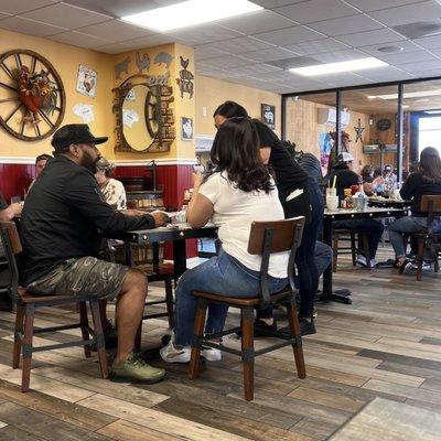 The woman who passed up guests and sat her people first  Put a old woman who's table this was on counter and sat her people here  ugly