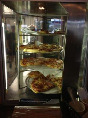 Pizza warming cabinet.  They have a selection of slices to choose from.