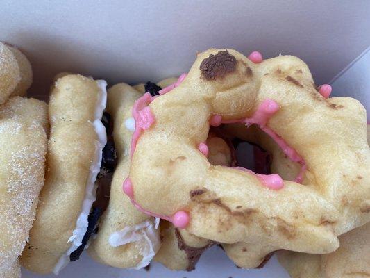 Mochi donut was squish and frosting touching other pieces.