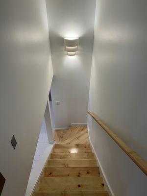 Stairwell going down to the basement - added a new light, steps, and handrail.