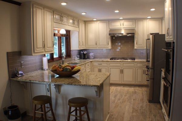 Cabinet refacing project, new Granite, tile floors, tile backsplash, cabinet modifications, can lights