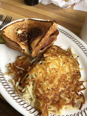 Egg sandwich with hash browns.