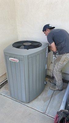 Kyle, inspecting an AC unit.