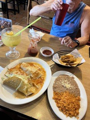 Combination plate with a taco, burrito, and quesadilla with side order of rice/beans!