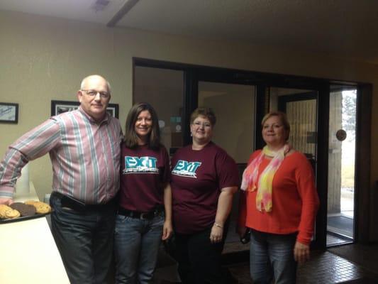 Team members Lynelle Phipps and Doreen Hoium with a couple of staff members from Enercept Building Systems.