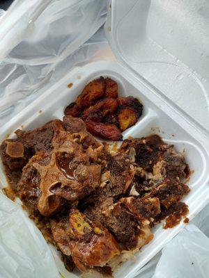 Jerk Chicken with Oxtails over rice, and Plantains