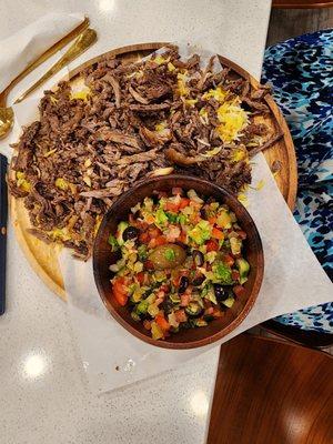 Saffron rice and beef shawarma with salad  .