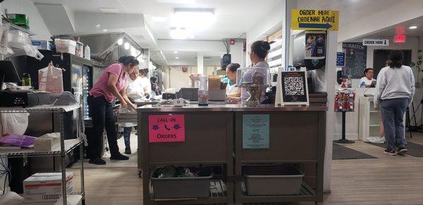 Employees hard at work making the best Burritos in Galveston