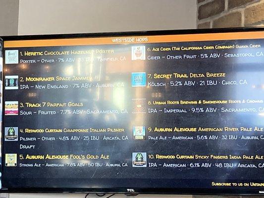 Beer menu on monitors.  10 beers on draft.