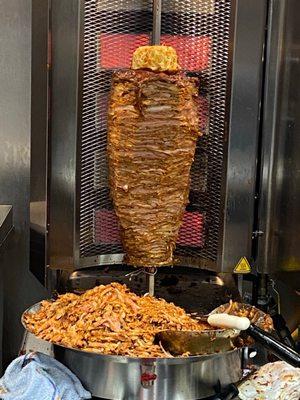 Al pastor meat off the spit