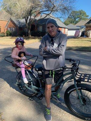 My daughter chillin on wife's new ride that Santa brought her