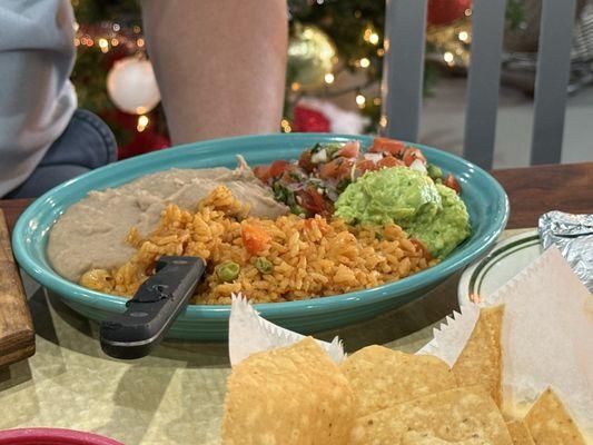 Refried beans and Spanish rice with guacamole and pico de gallo